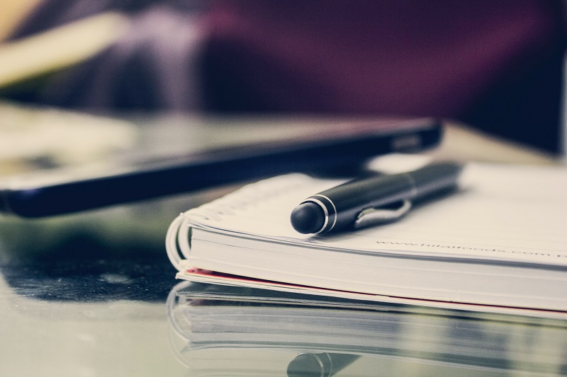 Pen on book